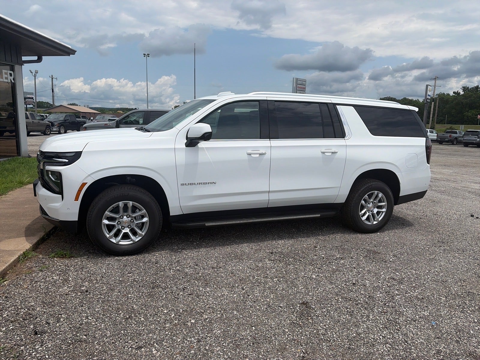 2026 Chevrolet Suburban LS in Summit White — front three-quarter view