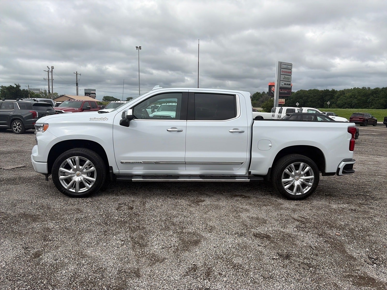2026 Chevrolet Silverado 1500 High Country in Polar White Tricoat — front three-quarter view